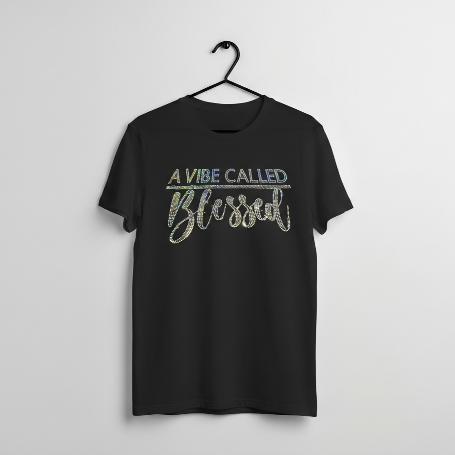 Black graphic t shirt with sparkling text that reads a vibe called blessed