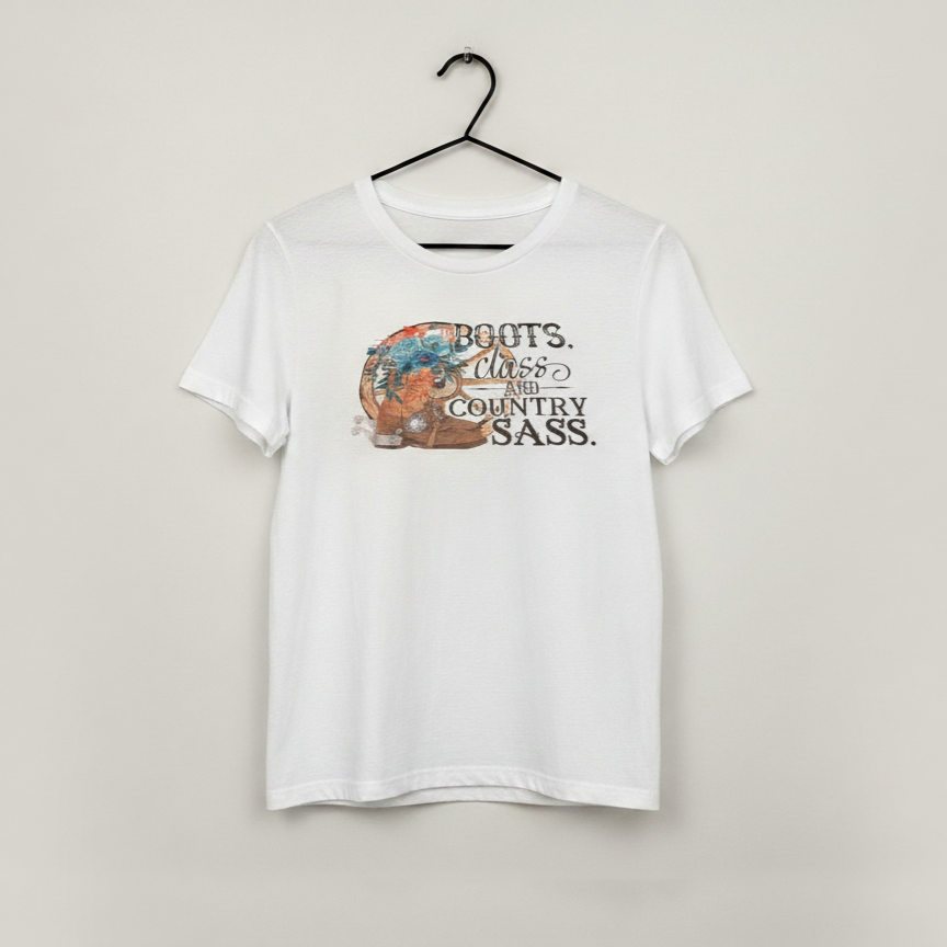 White graphic t shirt with western boots and floral design and the phrase boots class and country sass