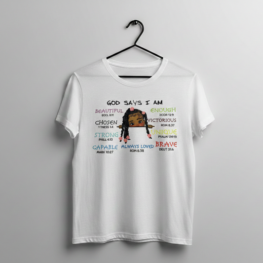 White graphic t shirt with text God Says I Am and colorful faith affirmations with scripture references with a little black girl with braids