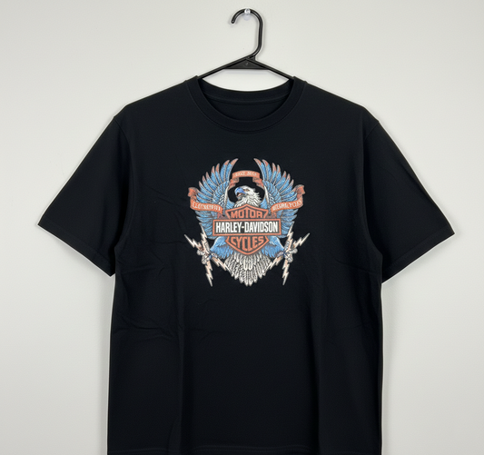 Black t-shirt with Harley-Davidson logo on a hanger against a white background