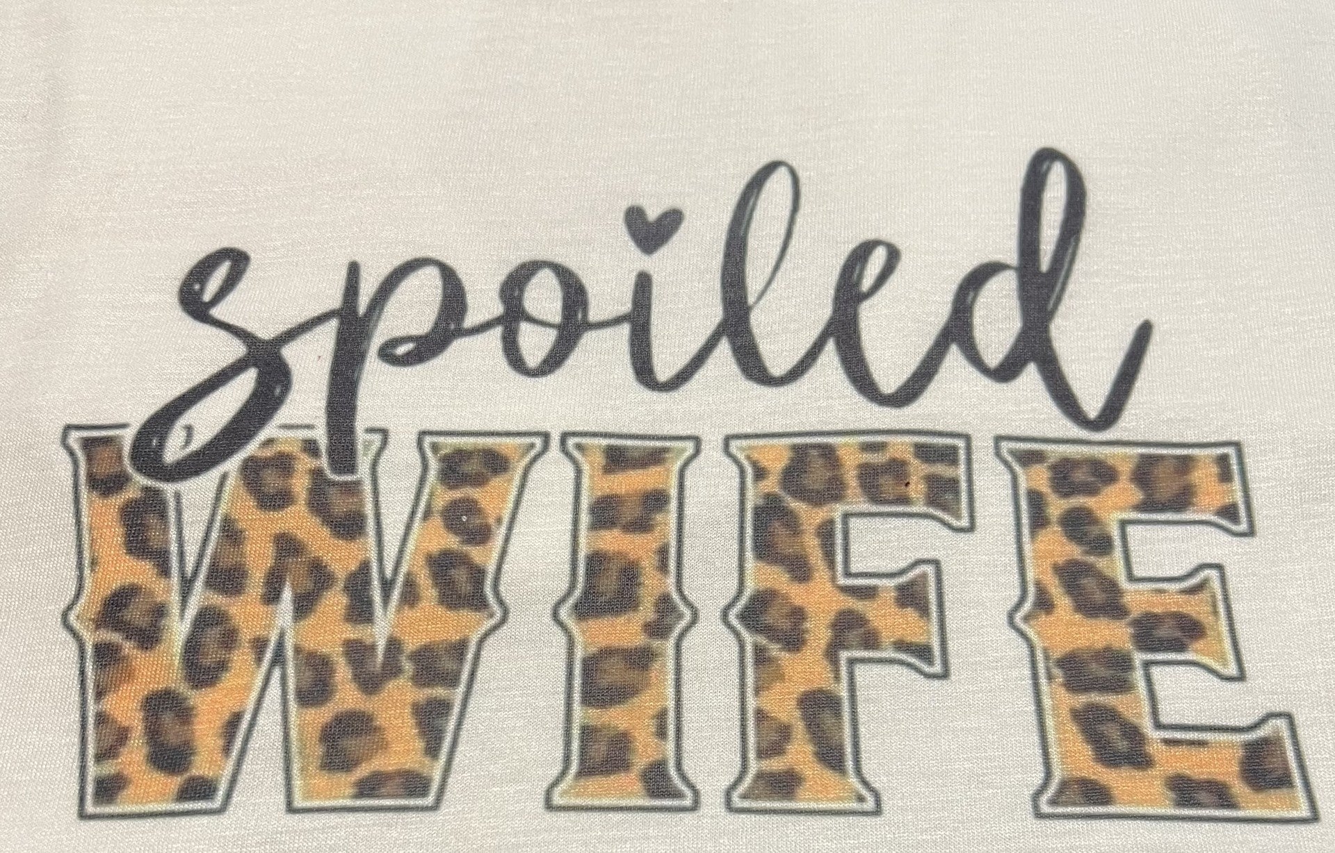 text that reads spoiled wife and leopard print wife lettering